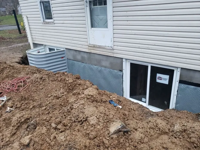 Bright, safe, and code-compliant egress window installation in a Massillon home basement, enhancing living space quality
