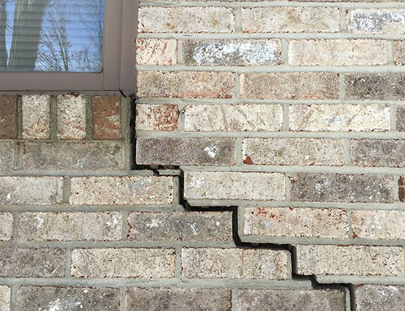 foundation repair process on an Akron residence, emphasizing enhanced structural integrity and safety