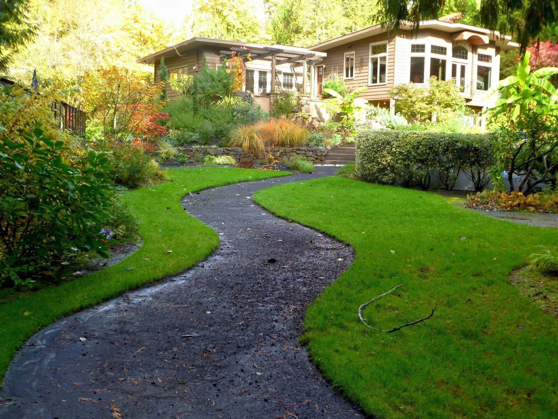 Custom yard drainage system installation in a Medina, Ohio, backyard to prevent water pooling and landscape erosion, preserving property aesthetics